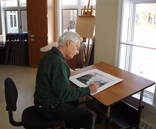 man in art studio painting