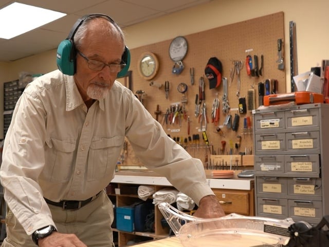 man using table saw 