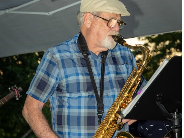George playing saxophone 