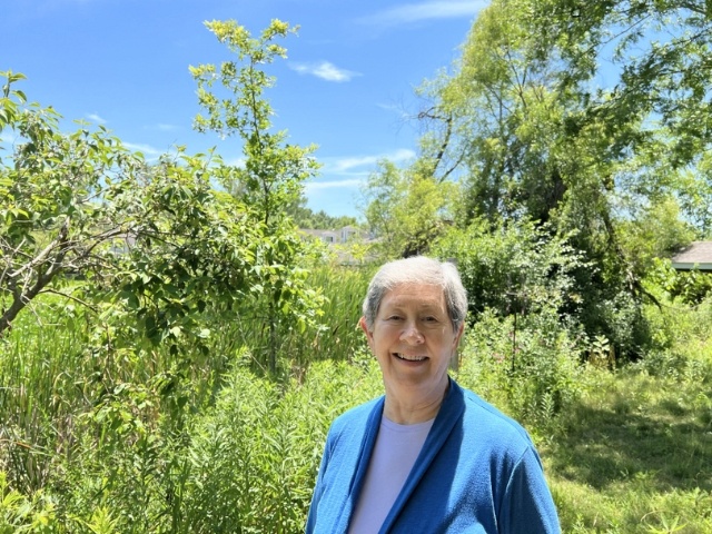 Dianne in front of trees at Kendal 