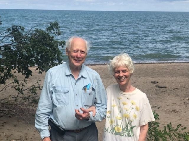 man and woman standing at the beach