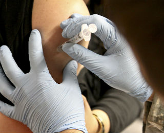 Vaccine is administered to an older adult