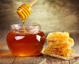 honey in a jar with honeycomb