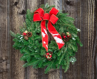 holiday wreath with red ribbon