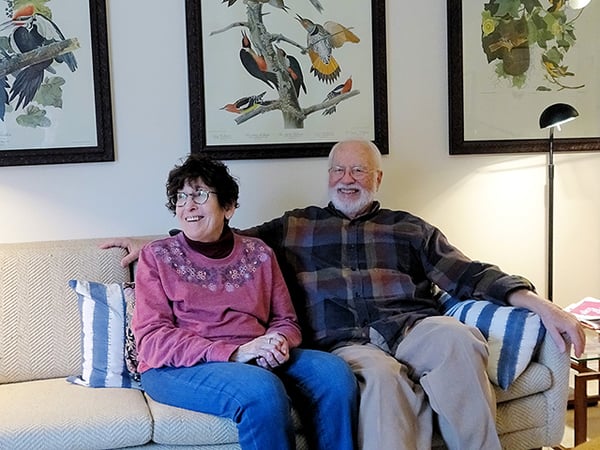 couple seated on a sofa