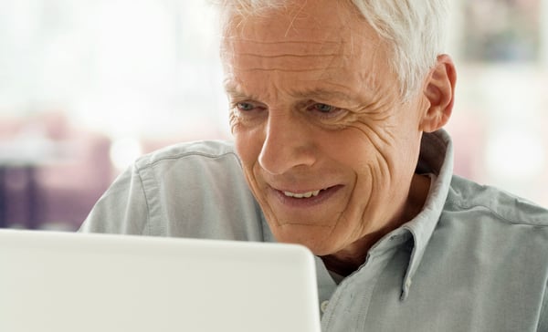 older man with laptop