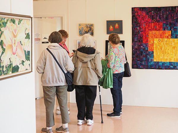 4 women in art gallery 