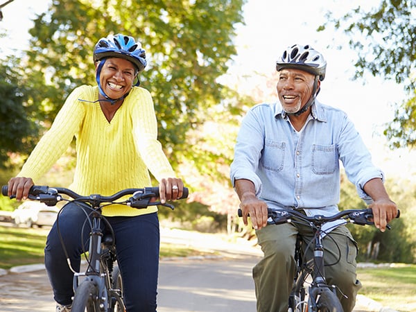 older couple bicycling 