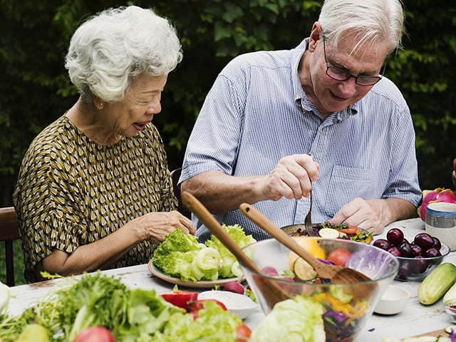 older couple eating healthy food