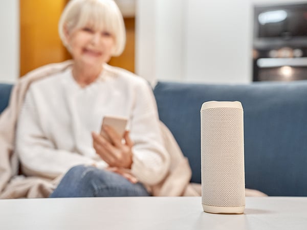 older woman with voice assistant