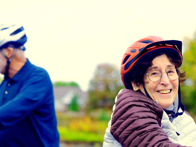woman smiling with helmet on 
