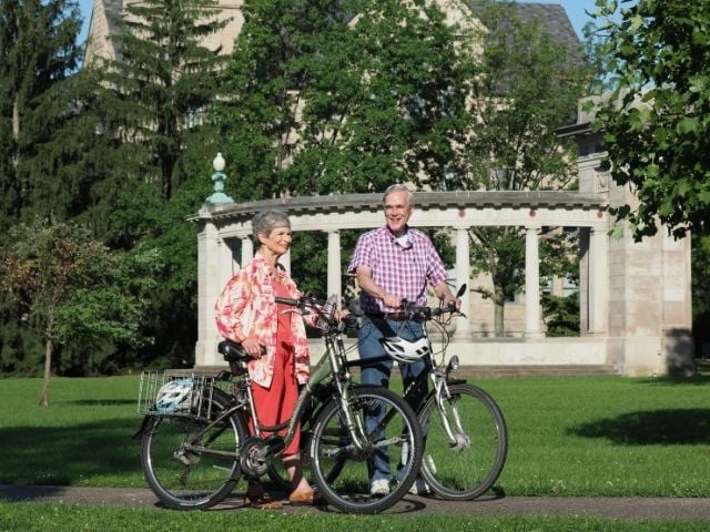 man and woman with bikes