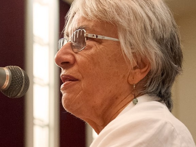 woman speaking into microphone 