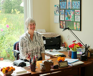  Resident working at her desk in an office