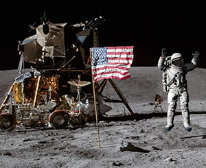 Astronaut on moon with American flag