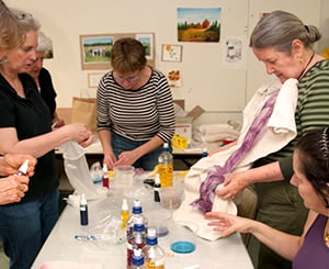 Group of residents volunteering and making art